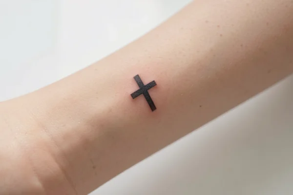 25 Inspiring Small Christian Tattoos Going Viral in 2026